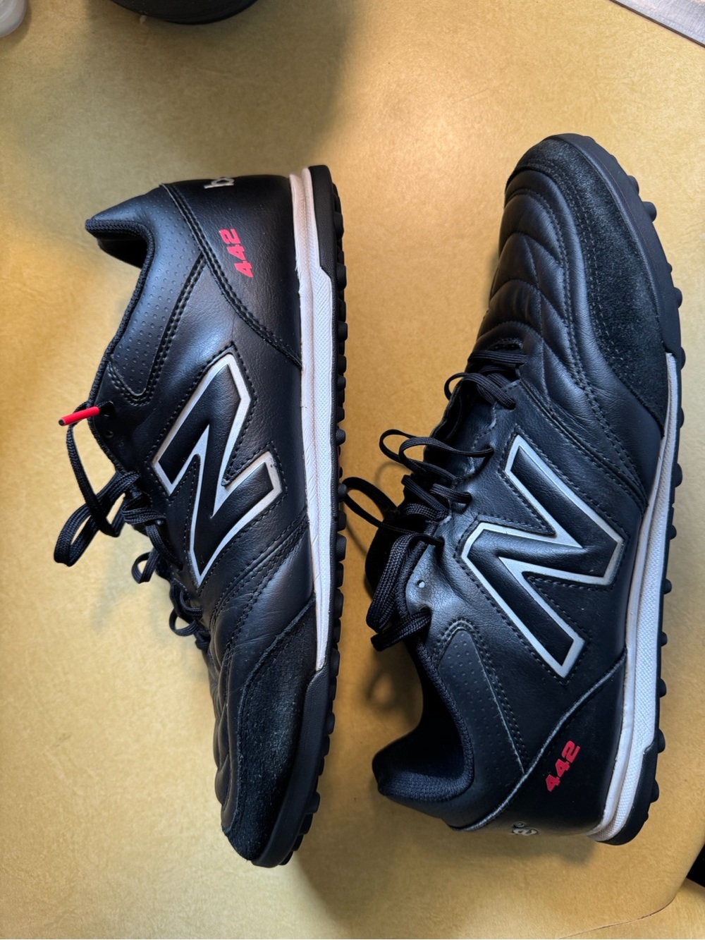 New Balance Black Men's Turf Sneakers with White and Red Accents
